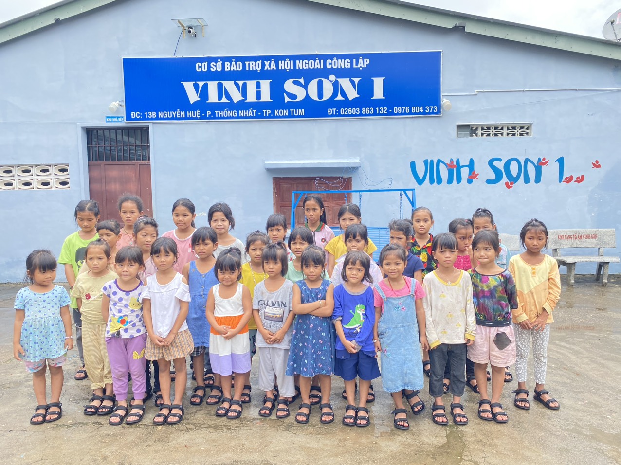 A group of smiling Vietnamese orphan children, wearing bright and colorful clothing, gather together. Vietnam B2B Direct is commited to supporting the children's education and well-being. The children, of various ages, exude joy and gratitude as they participate in activities provided by the company. The image captures a moment of happiness and hope, reflecting the positive impact of the sponsorship on their lives.